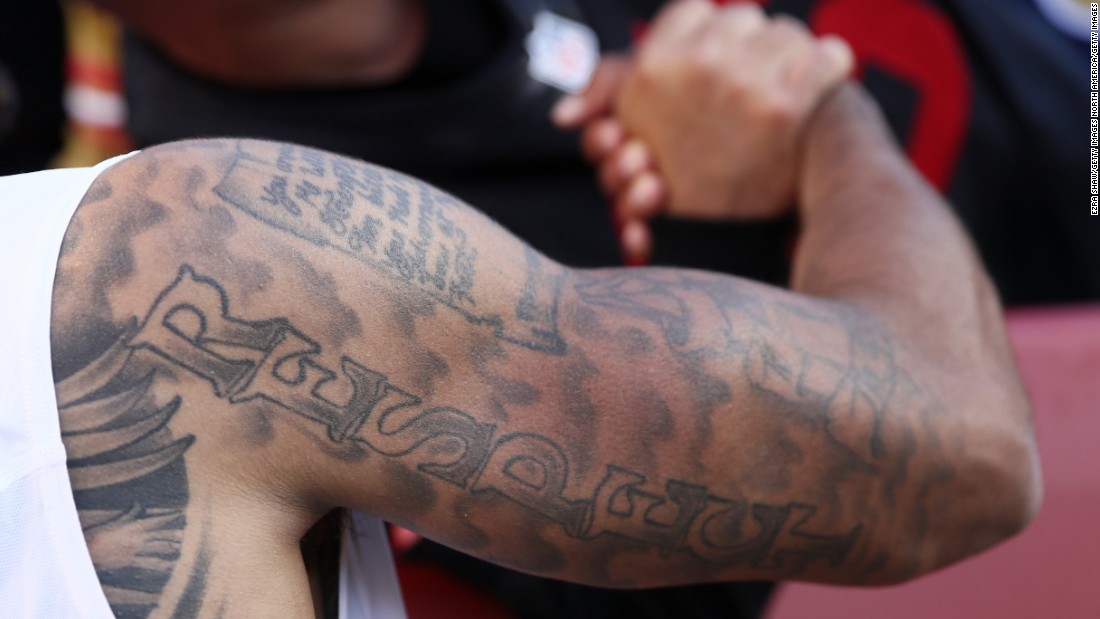 The upper half of NFL star Colin Kaepernick's right arm is covered in ink, as is most of his torso. Across his chest is written &quot;Against All Odds&quot; while down his arm is the word &quot;Respect.&quot;