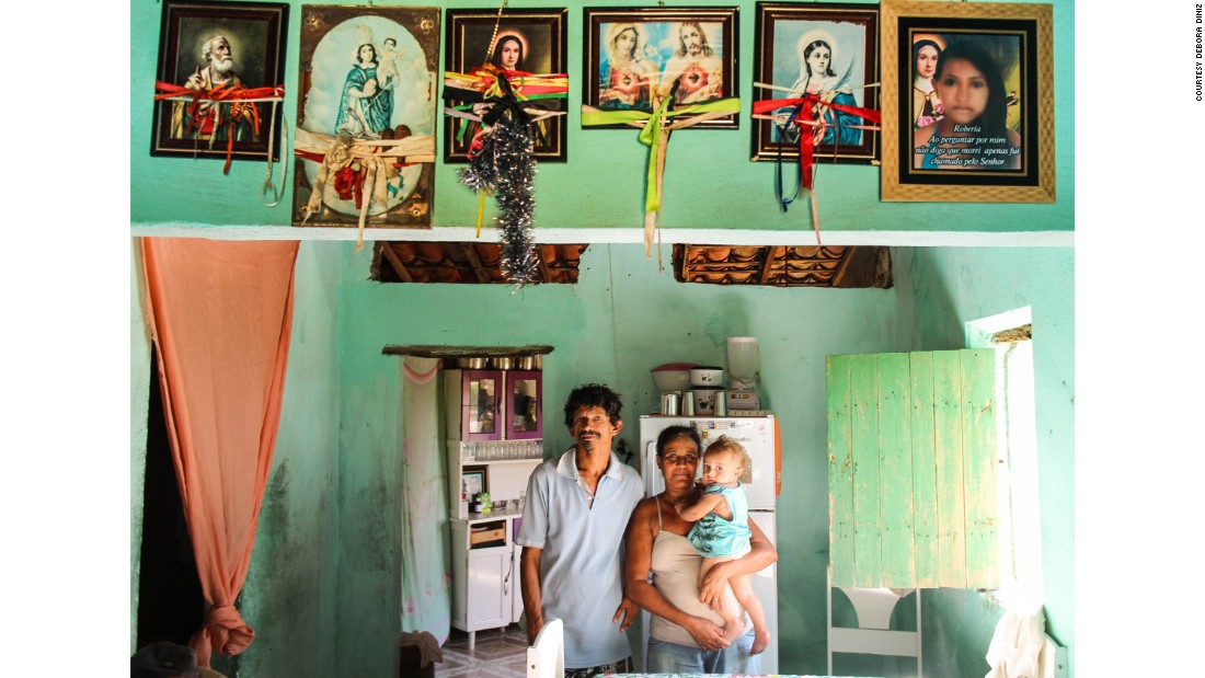 João Henrique, who has microcephaly, with his grandmother and grandfather in São José da Tapera. His mother, Robéria, died two months after giving birth.