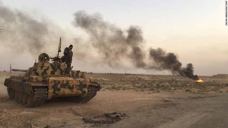 An SDF tank creates a smokescreen to conceal its position on the frontline. 