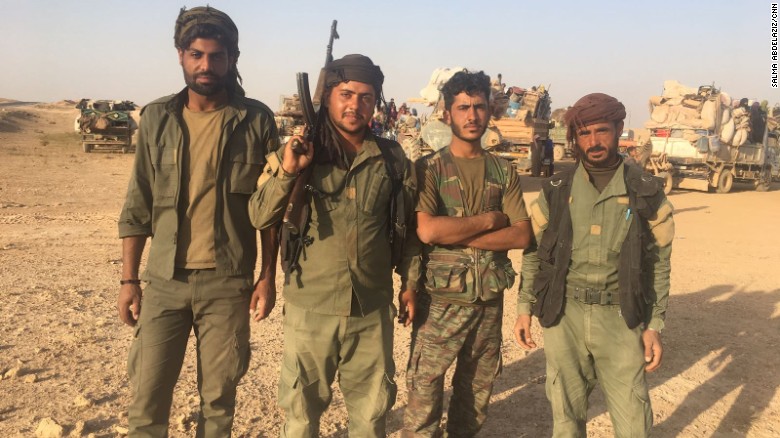 SDF fighters at a checkpoint outside Deir Ezzor. Their job is to search each family fleeing the city. 