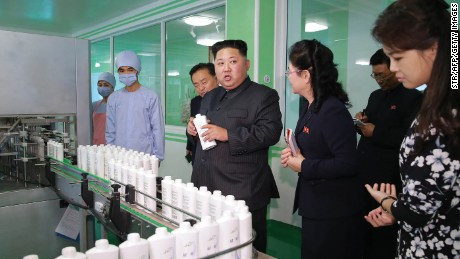 This undated picture released from North Korea&#39;s official Korean Central News Agency (KCNA) on October 29, 2017 shows North Korean leader Kim Jong-Un (C) inspecting the Pyongyang Cosmetics Factory, as his wife Ri Sol-Ju (R) looks on. / AFP PHOTO / KCNA VIA KNS / STR / South Korea OUT / REPUBLIC OF KOREA OUT   ---EDITORS NOTE--- RESTRICTED TO EDITORIAL USE - MANDATORY CREDIT &quot;AFP PHOTO/KCNA VIA KNS&quot; - NO MARKETING NO ADVERTISING CAMPAIGNS - DISTRIBUTED AS A SERVICE TO CLIENTS
THIS PICTURE WAS MADE AVAILABLE BY A THIRD PARTY. AFP CAN NOT INDEPENDENTLY VERIFY THE AUTHENTICITY, LOCATION, DATE AND CONTENT OF THIS IMAGE. THIS PHOTO IS DISTRIBUTED EXACTLY AS RECEIVED BY AFP.  /         (Photo credit should read STR/AFP/Getty Images)