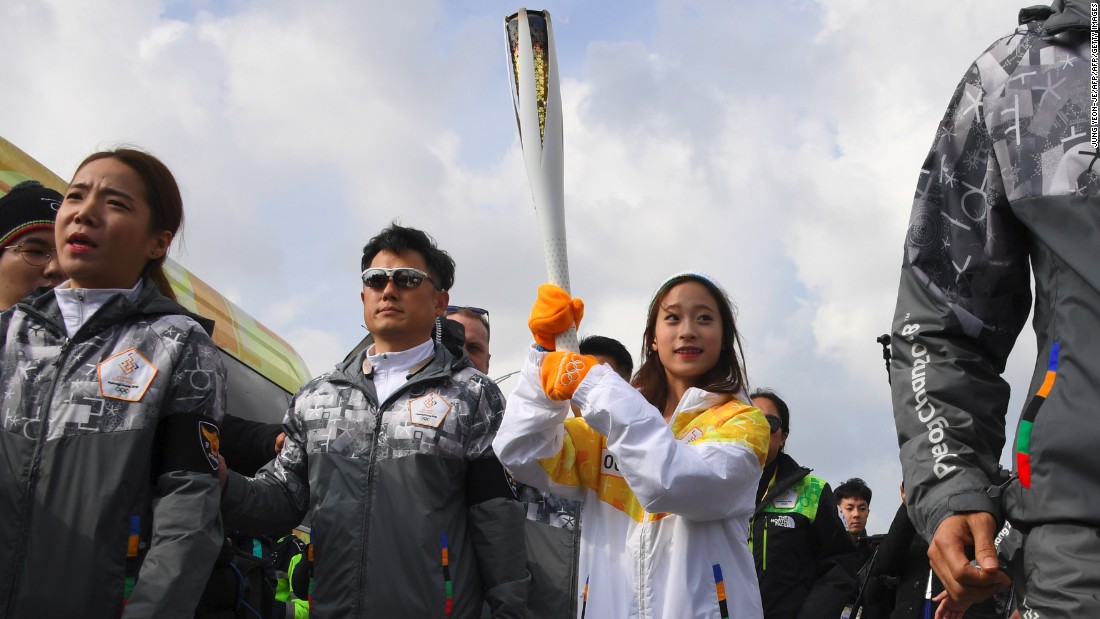 The honor of being the first to carry the Olympic flame on home soil fell to 13-year-old figure skating prodigy You Young. 
