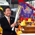 South Korean Prime Minister Lee Nak-Yon lights the Olympic torch incheon bridge pyeongchang winter games