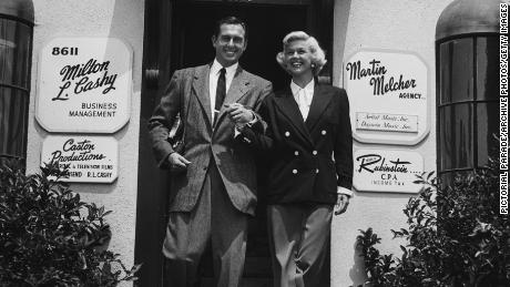 Actress Doris Day, with her husband and manager Marty Melcher, outside his talent agency in Hollywood, circa 1960. 