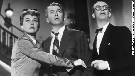 Doris Day and James Stewart (center) stand with British actor Richard Wattis in a still from director Alfred Hitchcock&#39;s film, &quot;The Man Who Knew Too Much.&quot;  