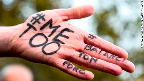 A picture shows the messages &quot;#Me too&quot; and #Balancetonporc (&quot;expose your pig&quot;) on the hand of a protester during a gathering against gender-based and sexual violence called by the Effronte-e-s Collective, on the Place de la Republique square in Paris on October 29, 2017.

#MeToo hashtag, is the campaign encouraging women to denounce experiences of sexual abuse that has swept across social media in the wake of the wave of allegations targeting Hollywood producer Harvey Weinstein.
 / AFP PHOTO / BERTRAND GUAY        (Photo credit should read BERTRAND GUAY/AFP/Getty Images)