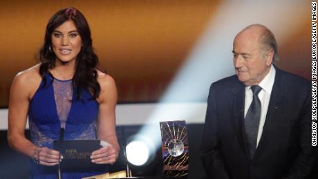 ZURICH, SWITZERLAND - JANUARY 07: (L-R) Hope Solo and Joseph Blatter, FIFA president announce Abby Wambach of United States during the FIFA womens player of the year trophy  during the FIFA Ballon d&#39;Or Gala 2013 at Congress House on January 07, 2013 in Zurich, Switzerland. (Photo by Christof Koepsel/Getty Images)