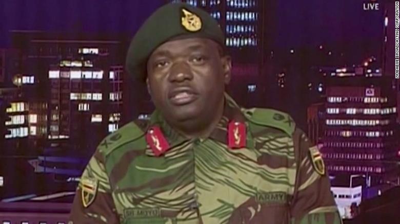 Maj. Gen. S.B. Moyo reads a statement during a TV broadcast on the Zimbabwe Broadcasting Corp.