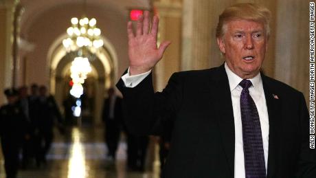 WASHINGTON, DC - NOVEMBER 16:  U.S. President Donald Trump waves as he leaves the Capitol after he attended a House Republican Conference meeting November 16, 2017 in Washington, DC. President Trump travels to Capitol Hill to discuss the tax reform bill as the House prepare to vote on the bill today.  (Photo by Alex Wong/Getty Images)