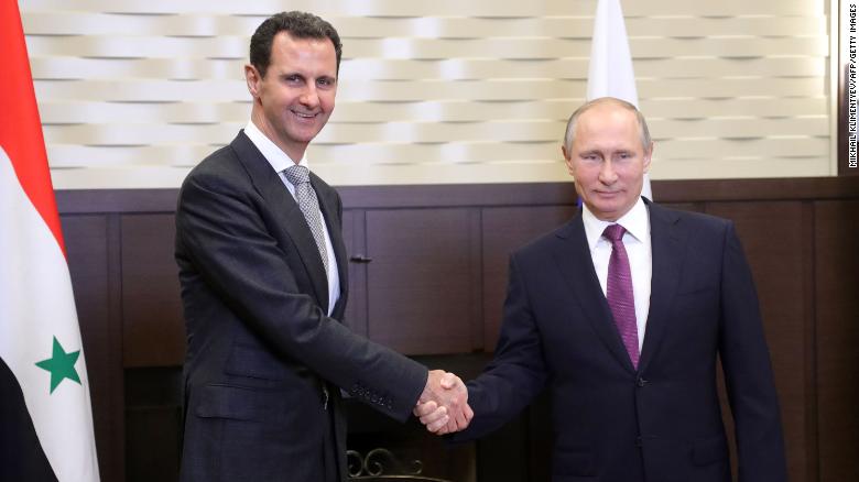 Russia&#39;s President Vladimir Putin, right, shakes hands with his Syrian counterpart Bashar al-Assad during a meeting in Sochi, Russia, in November.