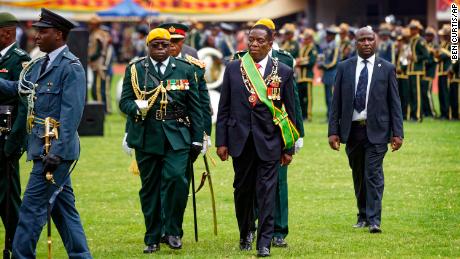 Emmerson Mnangagwa inspects the military parade after being sworn.