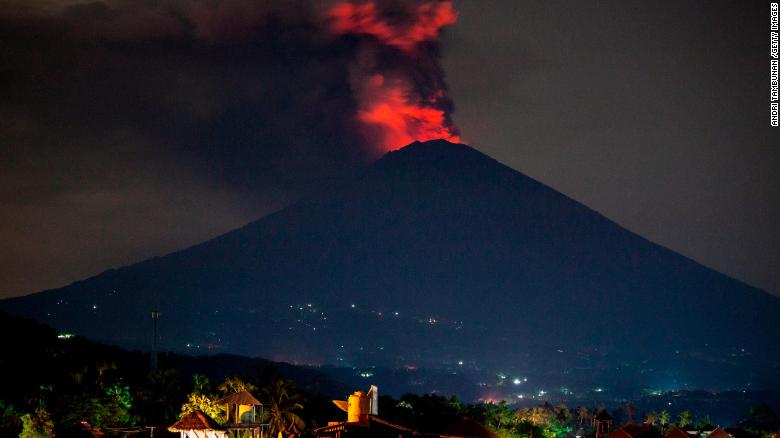 Mount Agung spews volcanic ash into the night sky on Monday, November 27,  near Karangasem, Bali, Indonesia.  Authorities have issued the highest-level warning possible after volcanic eruptions from Mount Agung on the Indonesian resort island of Bali forced the closure of the island&#39;s main airport and evacuation of thousands of residents living nearby.