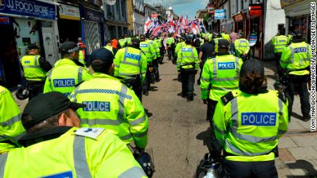 Police officers monitor a Britain First protest march in Luton, England, in June 2015.