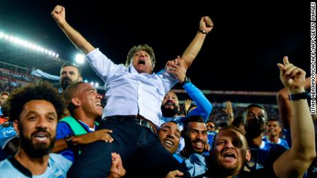 Renato Gaucho is held aloft by his players after guiding the to Libertadores glory.