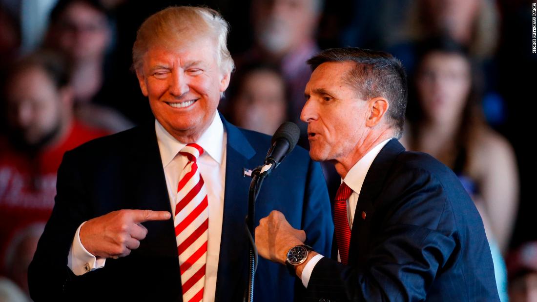 GRAND JUNCTION, CO - OCTOBER 18: Republican presidential candidate Donald Trump (L) jokes with retired Gen. Michael Flynn as they speak at a rally at Grand Junction Regional Airport on October 18, 2016 in Grand Junction Colorado. Trump is on his way to Las Vegas for the third and final presidential debate against Democratic rival Hillary Clinton. (Photo by George Frey/Getty Images)