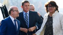 Former Trump national security adviser Michael Flynn, center, arrives at federal court in Washington, Friday, Dec. 1, 2017. Court documents show Flynn, an early and vocal supporter on the campaign trail of President Donald Trump whose business dealings and foreign interactions made him a central focus of Mueller&#39;s investigation, will admit to lying about his conversations with Russia&#39;s ambassador to the United States during the transition period before Trump&#39;s inauguration.  (AP Photo/Susan Walsh)