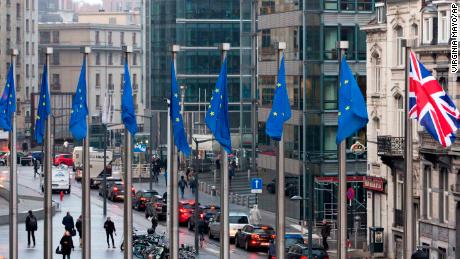 Flags flap in the wind outside the EU headquarters in Brussels on Monday.