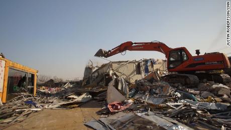 A market in south Beijing is torn down by a bulldozer days after the government issued demolition orders for thousands of structures.