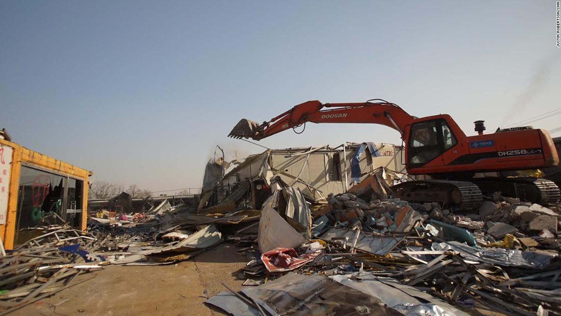 A market in south Beijing is torn down by a bulldozer days after the government issued demolition orders for thousands of structures.