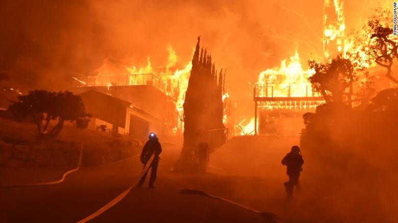 Firefighters battle to put out a blaze engulfing homes in Ventura on December 5. 