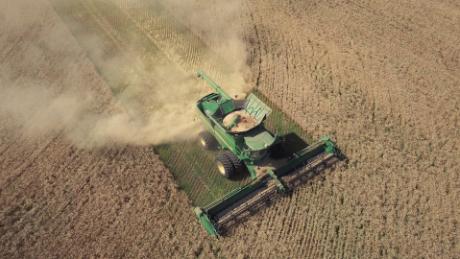 On the Stevens Family Farm in Glenburn, ND, a combine harvests wheat during a significant drought in the region.
