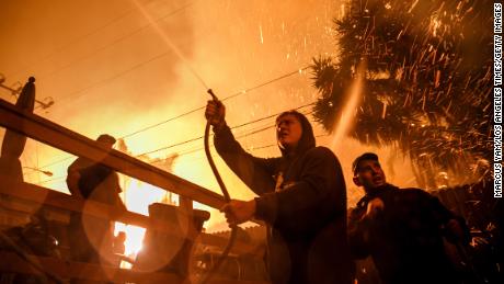 As the California wildfires consumed houses, four friends grabbed garden hoses and went to work