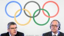 International Olympic Committee (IOC) President Thomas Bach (L) and Chair of IOC Inquiry Commission into alleged Russian doping at Sochi 2014 Swiss Samuel Schmid attend a press conference following an executive meeting on Russian doping, on December 5, 2017 in Lausanne.
Russia were banned from the 2018 Olympics on December 5 over state-sponsored doping but the International Olympic Committee said Russian competitors would be able to compete &quot;under strict conditions&quot;. / AFP PHOTO / Fabrice COFFRINI        (Photo credit should read FABRICE COFFRINI/AFP/Getty Images)