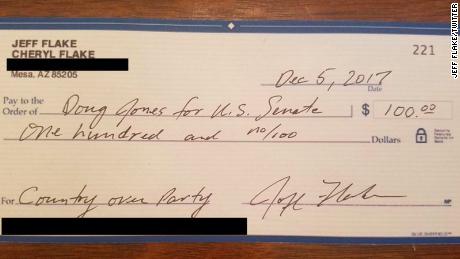 Flake writes check to Democrat opposing Moore