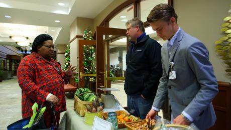 Mason and Scott Tyson hand out food at the Cancer Treatment Centers of America in Newnan, Georgia. 