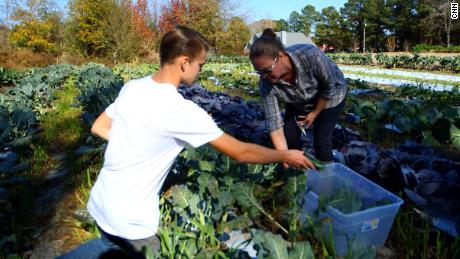 Mason, now 15, and Nicole Tyson harvest food on their farm in Sharpsburg, Georgia. 