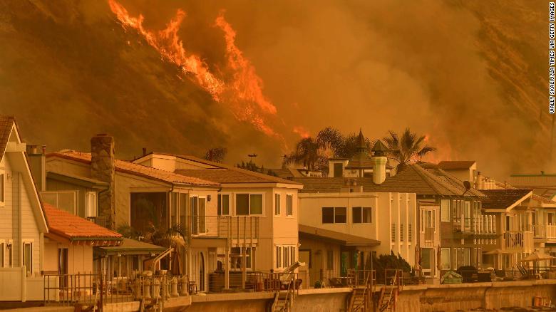 The Thomas Fire threatened several beachfront homes Wednesday in Ventura, California.