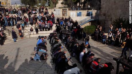 Muslims pray at the Damascus Gate entrance to Jerusalem's Old City on Thursday.