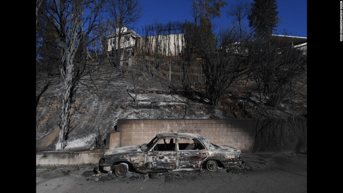A burnt Mercedes is seen after the Skirball Fire swept through the Los Angeles neighborhood of Bel-Air on Thursday, December 7.
