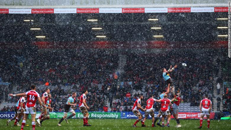 A rugby match went ahead at Twickenham Stoop in London despite the heavy snow. 