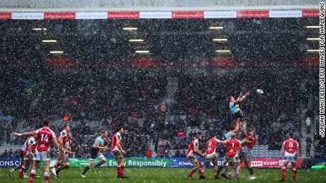A rugby match went ahead at Twickenham Stoop in London despite the heavy snow. 