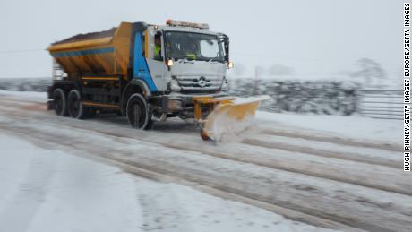 A snow plow clears country lanes in Welsh Frankton, England. 