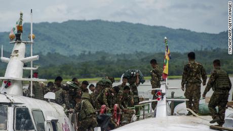 Myanmar soldiers arrive at Buthidaung jetty in Myanmar&#39;s Rakhine State on August 29, 2017.

