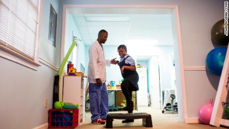 Schnaika, 9, suffers weakness in the left side of her body and sees therapist Antonio Pruitt once a week.