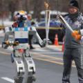 01 robot carries olympic torch 1211