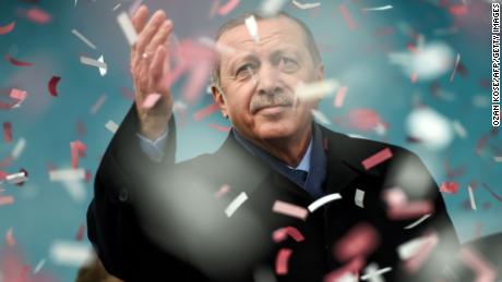 Turkish President Recep Tayyip Erdogan gestures amid confetti during a rally in Istanbul.