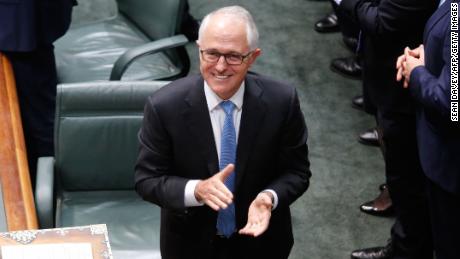 Australian Prime Minister Malcolm Turnbull applauds after the passage of the same-sex marriage bill in the federal Parliament.