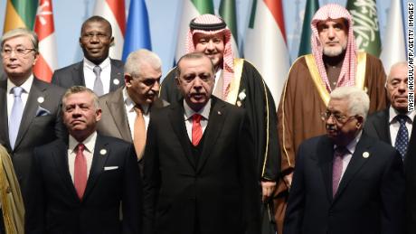 Turkish President Erdogan (front row, C) and Palestinian Authority President Abbas (front row, R) with other leaders at the OIC summit