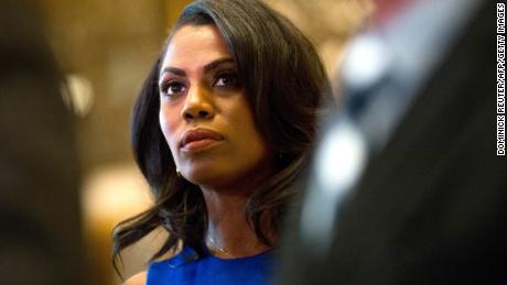 Omarosa Manigault, a staffer for US President-elect Donald Trump, listens as Martin Luther King III speaks to the media after meeting with the President-elect at Trump Tower in New York City on January 16, 2017.  / AFP / DOMINICK REUTER        (Photo credit should read DOMINICK REUTER/AFP/Getty Images)