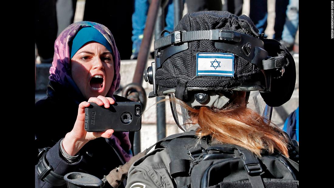 A Palestinian protester points her phone at an Israeli soldier Friday, December 8, by the Damascus Gate entrance to Jerusalem&#39;s Old City. Following US President Donald Trump&#39;s decision to recognize Jerusalem as the capital of Israel, &lt;a href=&quot;http://www.cnn.com/2017/12/08/middleeast/jerusalem-trump-friday-prayers-protests-intl/index.html&quot; target=&quot;_blank&quot;&gt;brief scuffles broke out&lt;/a&gt; by the Damascus Gate, where protesters chanted slogans and held Palestinian flags aloft. Protesters and Israeli forces also clashed in Gaza and the West Bank.