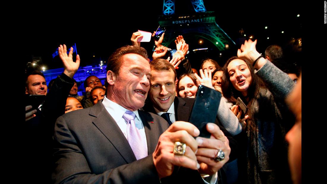 Actor Arnold Schwarzenegger takes a selfie with French President Emmanuel Macron as their boat cruises past the Eiffel Tower in Paris on Tuesday, December 12. They were coming back from the &lt;a href=&quot;http://www.cnn.com/2017/12/12/europe/macron-paris-climate-change-intl/index.html&quot; target=&quot;_blank&quot;&gt;One Planet Summit,&lt;/a&gt; where world leaders gathered to show their commitment to the 2015 Paris Agreement on climate change.