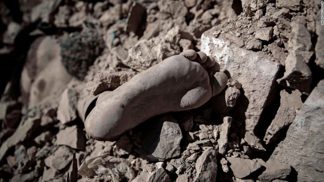A body is buried in rubble after &lt;a href=&quot;http://www.cnn.com/2017/12/13/middleeast/yemen-airstrike-intl/index.html&quot; target=&quot;_blank&quot;&gt;an airstrike on a Houthi-held detention center&lt;/a&gt; in Sanaa, Yemen, on Wednesday, December 13.  For more than two years, a coalition led by Saudi Arabia has been fighting Iranian-backed Houthi rebels in Yemen.
