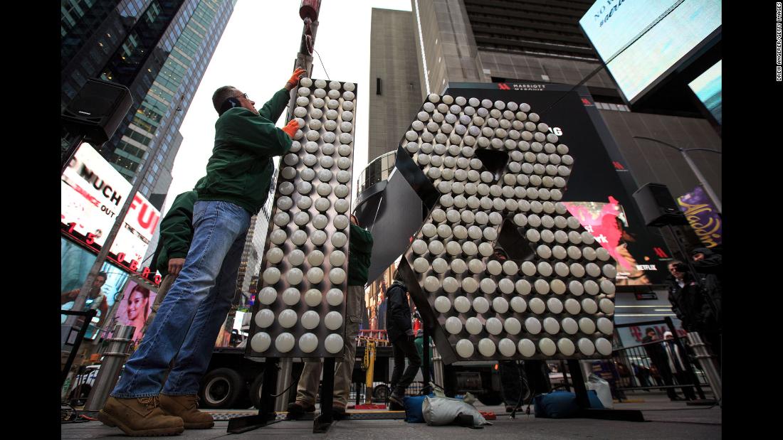 Workers prepare a display Wednesday, December 13, for the New Year&#39;s Eve celebration in New York&#39;s Times Square.