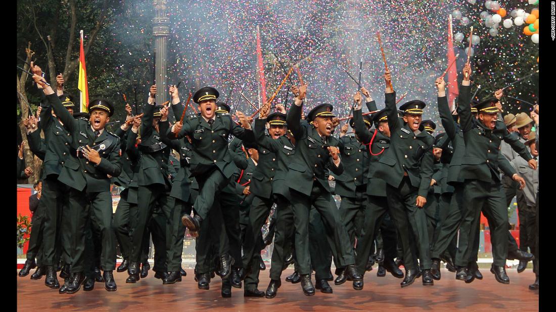 Army cadets celebrate after their graduation ceremony in Gaya, India, on Saturday, December 9.