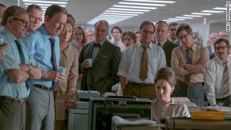 (From left) Howard Simons (David Cross), Frederick "Fritz" Beebe (Tracy Letts), Ben Bradlee (Tom Hanks), Kay Graham (Meryl Streep), Arthur Parsons (Bradley Whitford), Chalmers Roberts (Philip Casnoff), Paul Ignatius (Brent Langdon), Meg Greenfield (Carrie Coon, seated) and other members of The Washington Post in Twentieth Century Fox's 'The Post.'