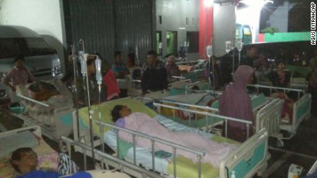 Patients are evacuated outside a hospital in Banyumas overnight after an earthquake on the Indonesian island of Java.